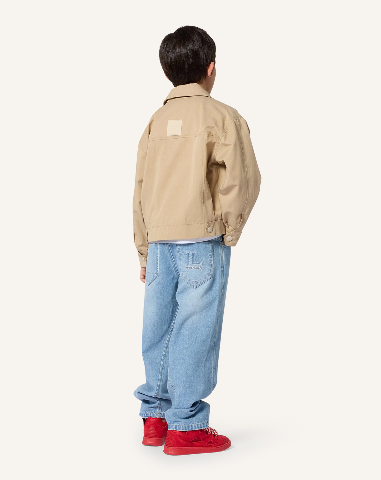 PANTALON TWISTÉ EN DENIM BLEU